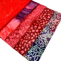 Included in this deal: cherry red batik fabric fat quarter bundle